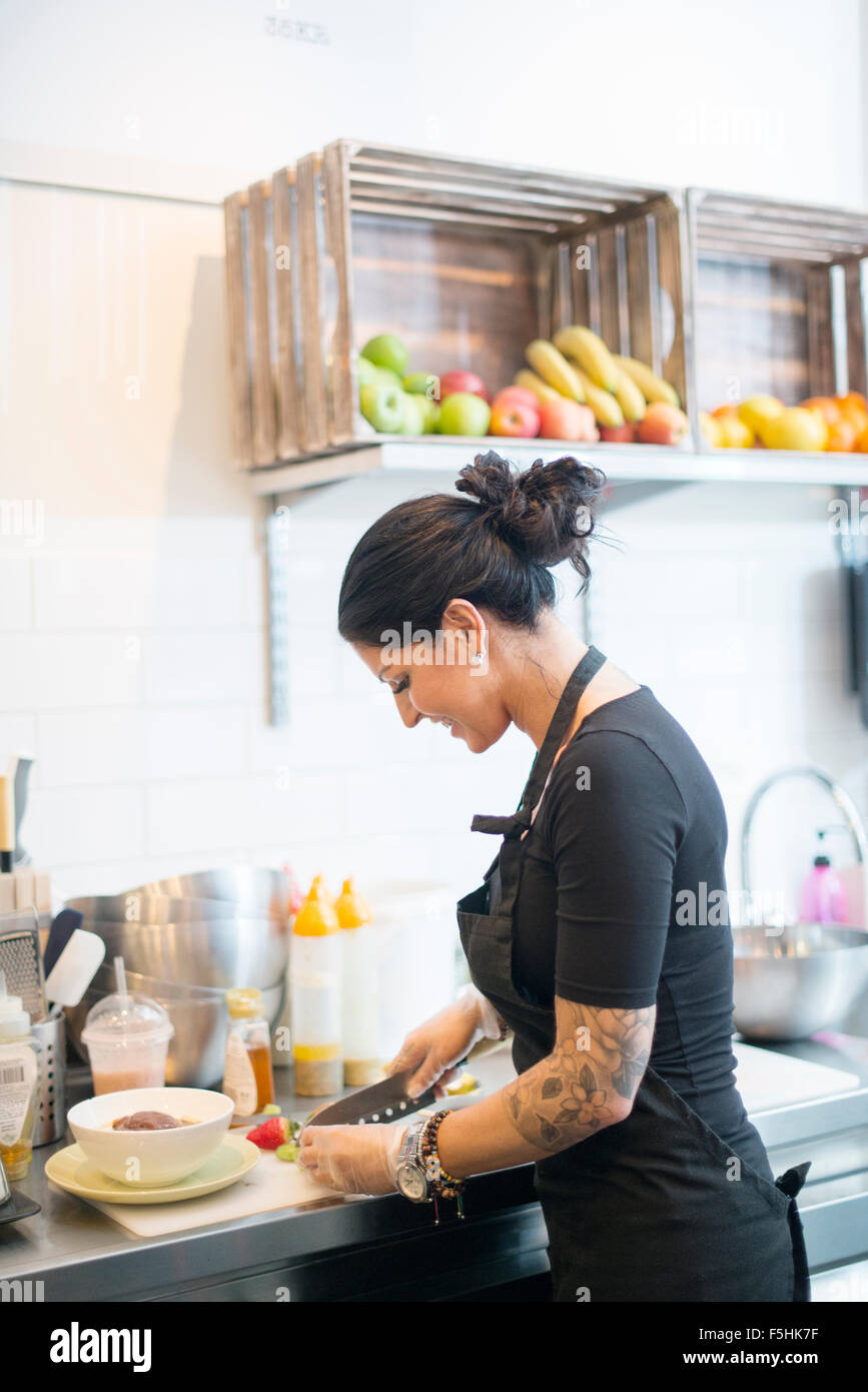Sweden, Portrait of woman working in cafe Stock Photo