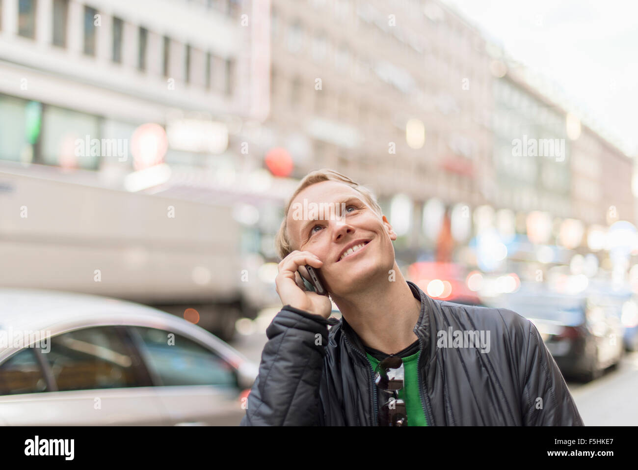 Sweden, Uppland, Stockholm, Kungsgatan, Mid-adult man talking on phone Stock Photo