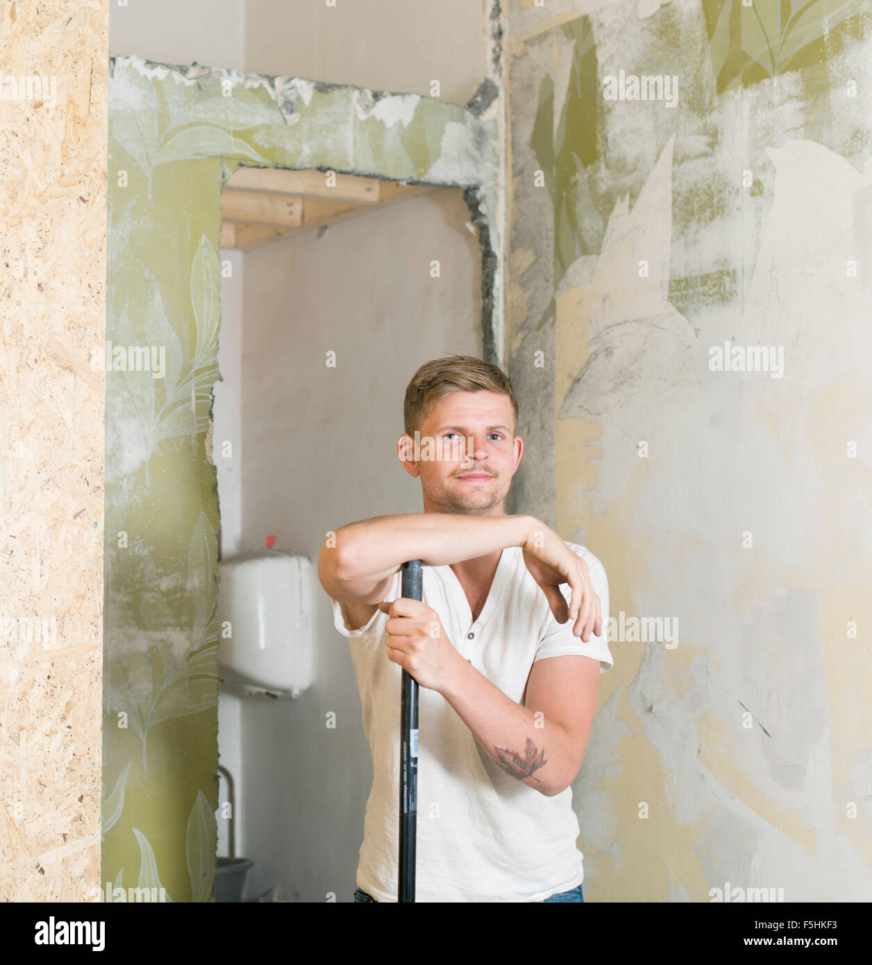 Sweden, Portrait of man renovating his home Stock Photo