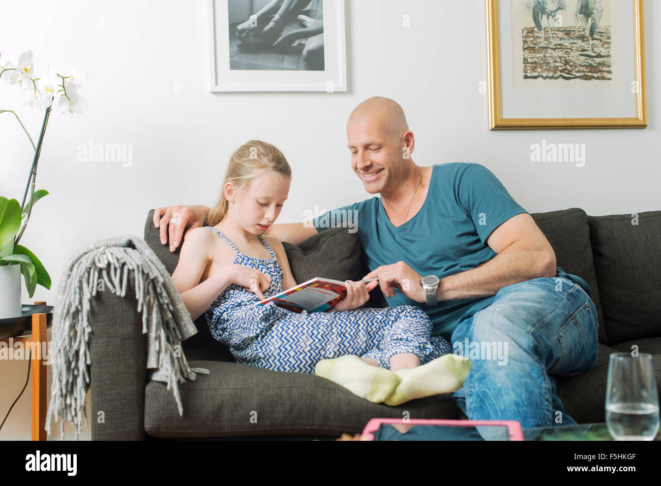 Sweden, Father doing homework with daughter (8-9) Stock Photo