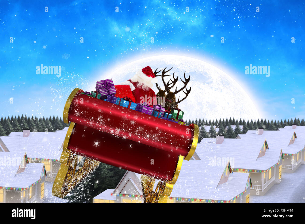 Composite image of santa flying his sleigh Stock Photo