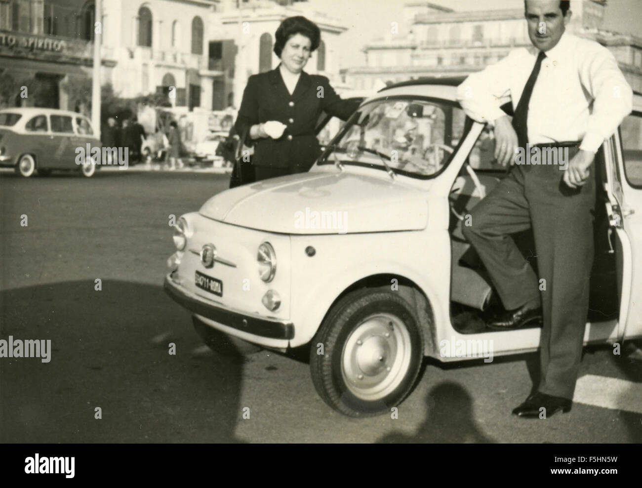 A couple with the Fiat 500 car, Italy Stock Photo