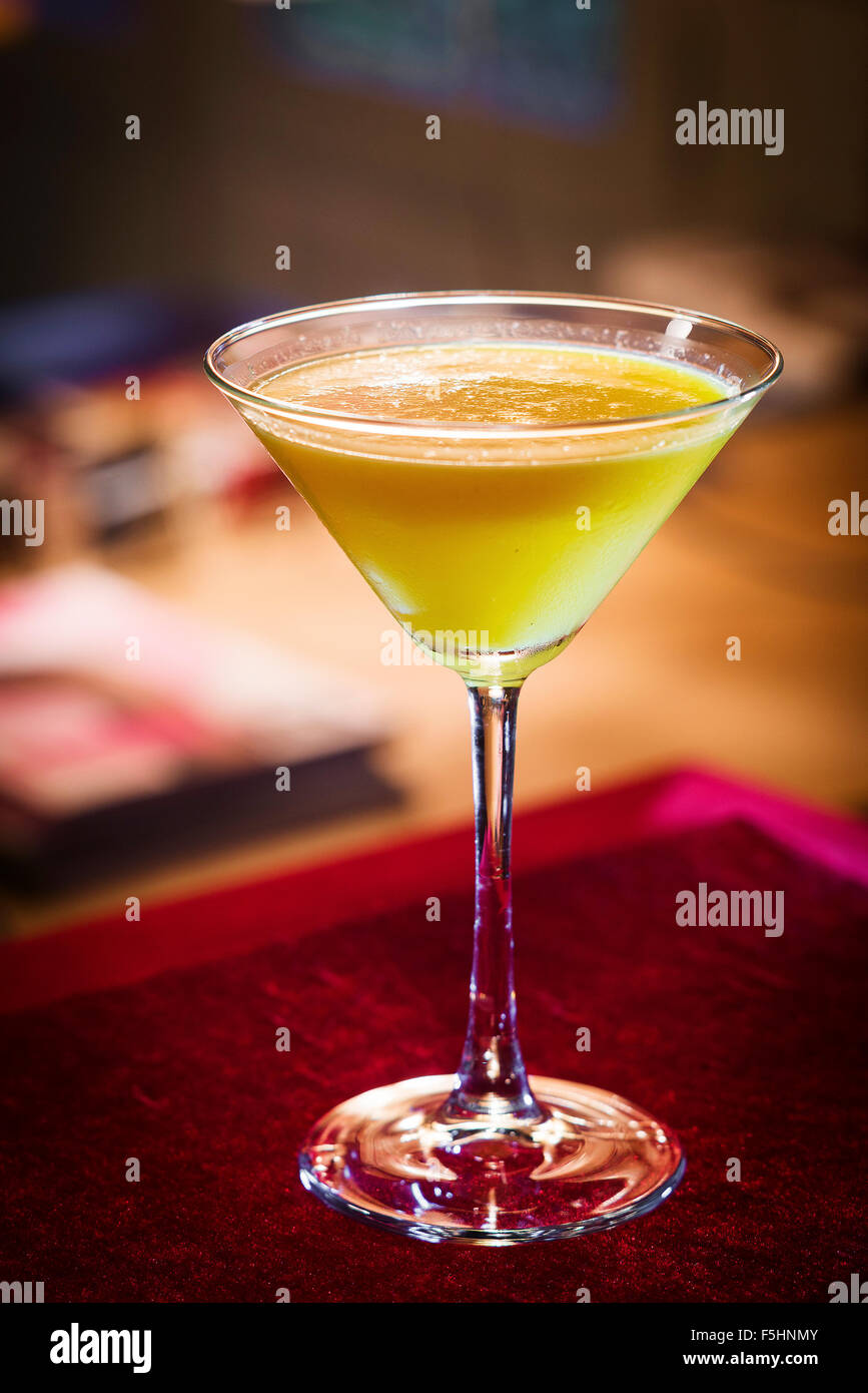 creme caramel martini cocktail drink in trendy bar interior Stock Photo