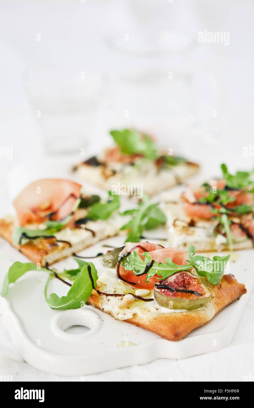 Sweden, Pizza with goat cheese cream, rocket, pine nuts, figs and parma