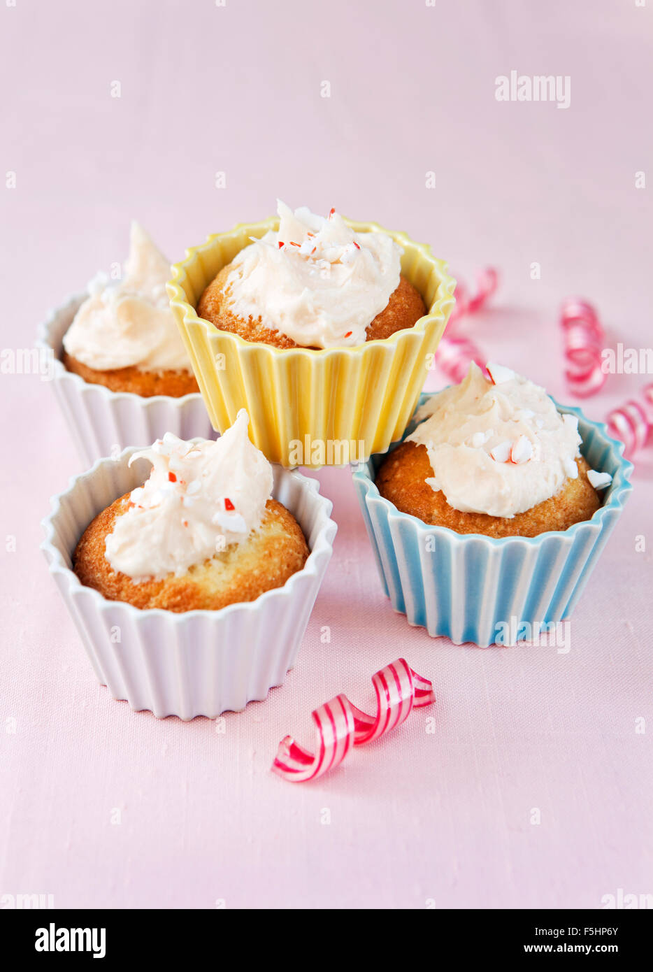 Studio shot of muffins with crushed Polkagris, famous red and white swedish boiled sweets Stock Photo