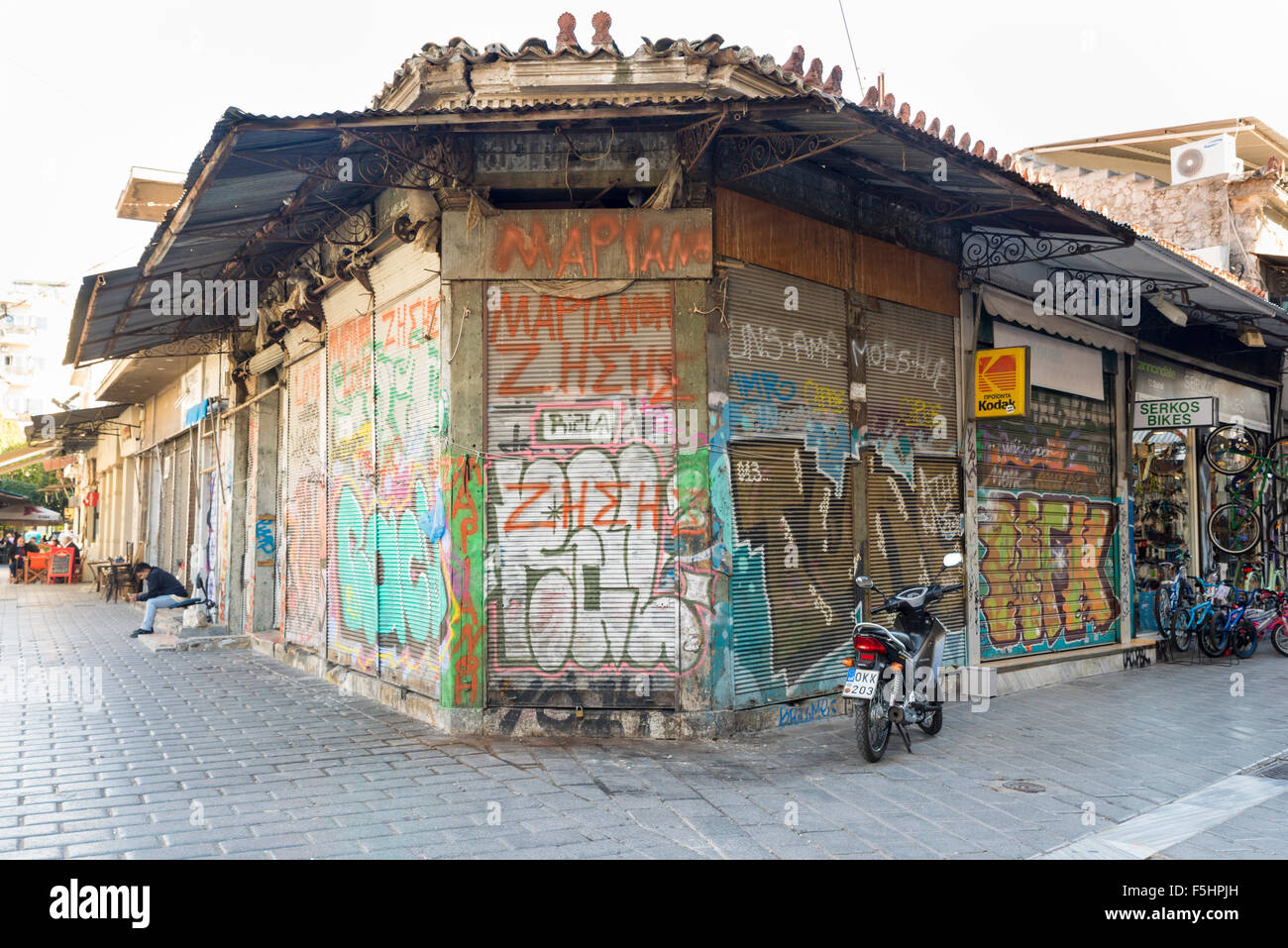 ATHENS, GREECE - OCTOBER 27, 2015: Flea market at Avissinias Square. Stores closed by the economic crisis Stock Photo