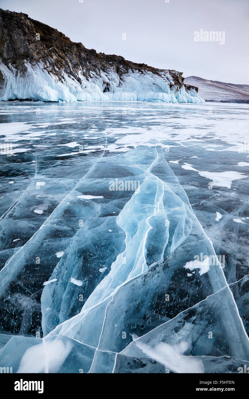 Rocks frozen into the ice of siberian Baikal Lake in winter Stock Photo