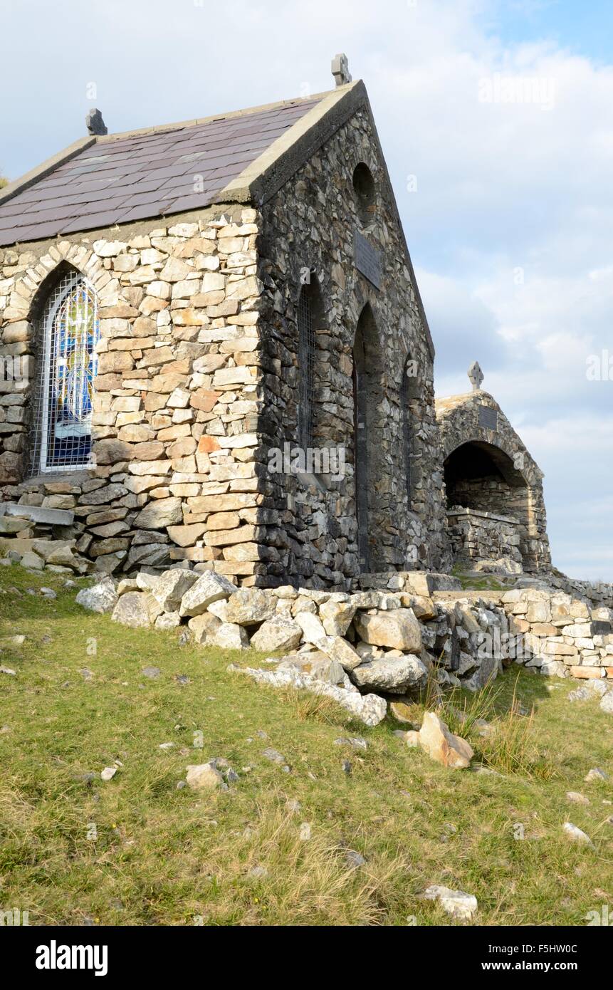 Chapel shrine and altar dedicated to St Patrick at the summit of a rugged pilgrims trail Maumturk Mountains Connemara Ireland Stock Photo