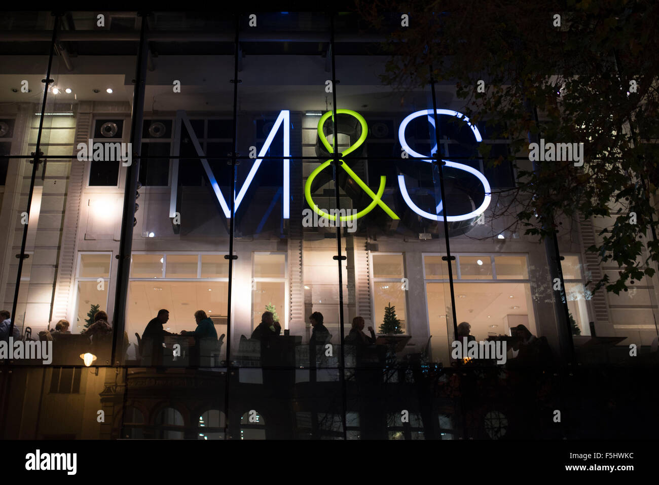A Mark's and Spencers (M&S) retail store at night. Stock Photo