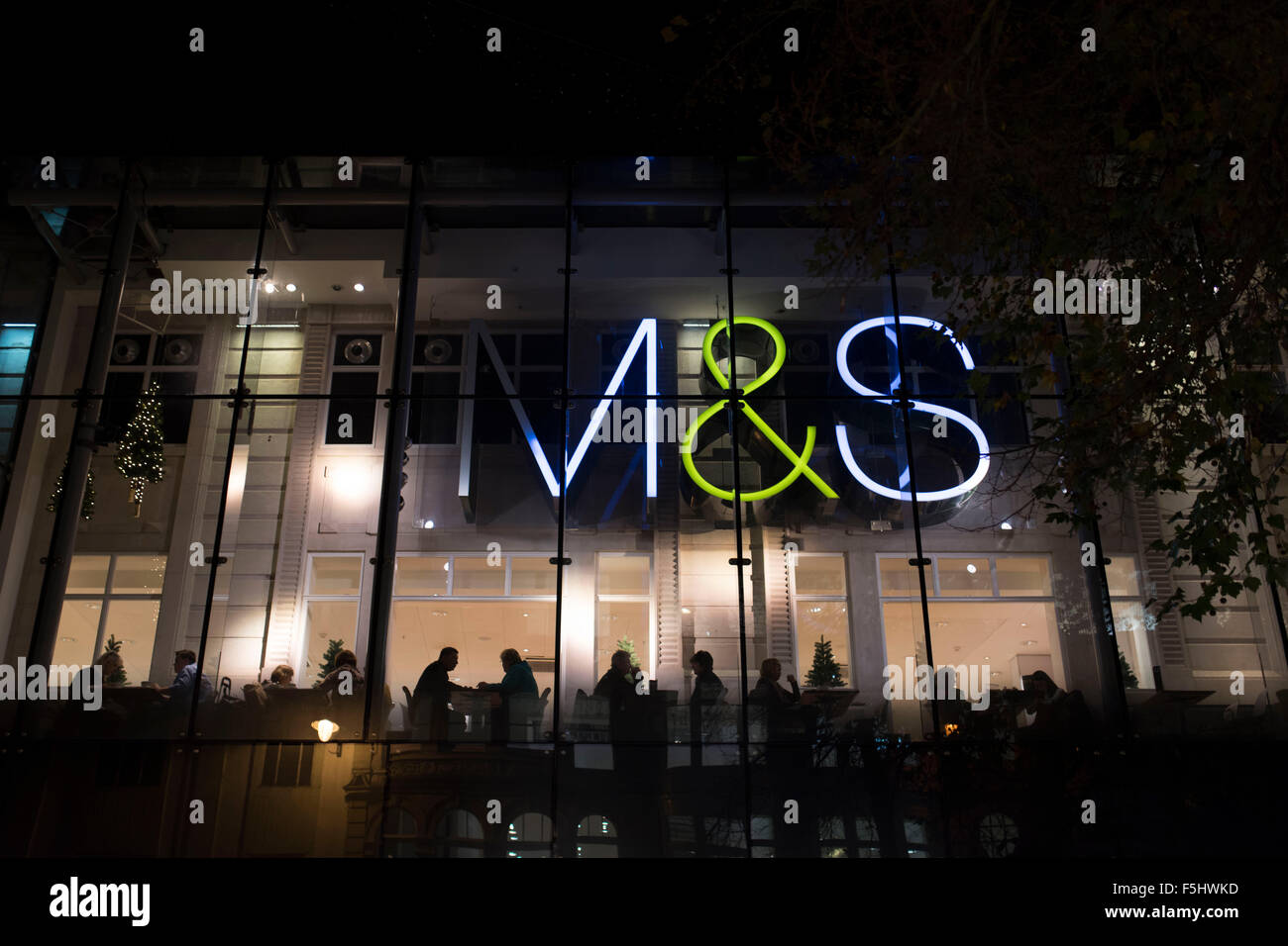 A Mark's and Spencers (M&S) retail store at night. Stock Photo