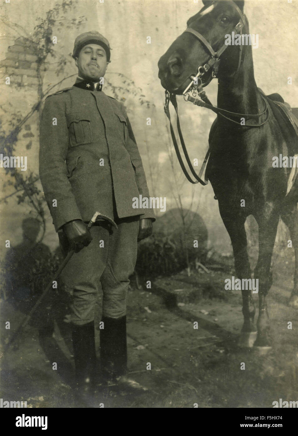 A trooper beside his horse, Italy Stock Photo
