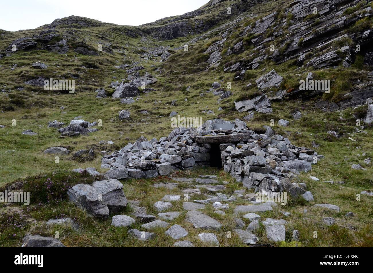 St Patricks Holy Well at the summit of a rugged track through the Maumturk Mountains Connemara Iirealnd Stock Photo
