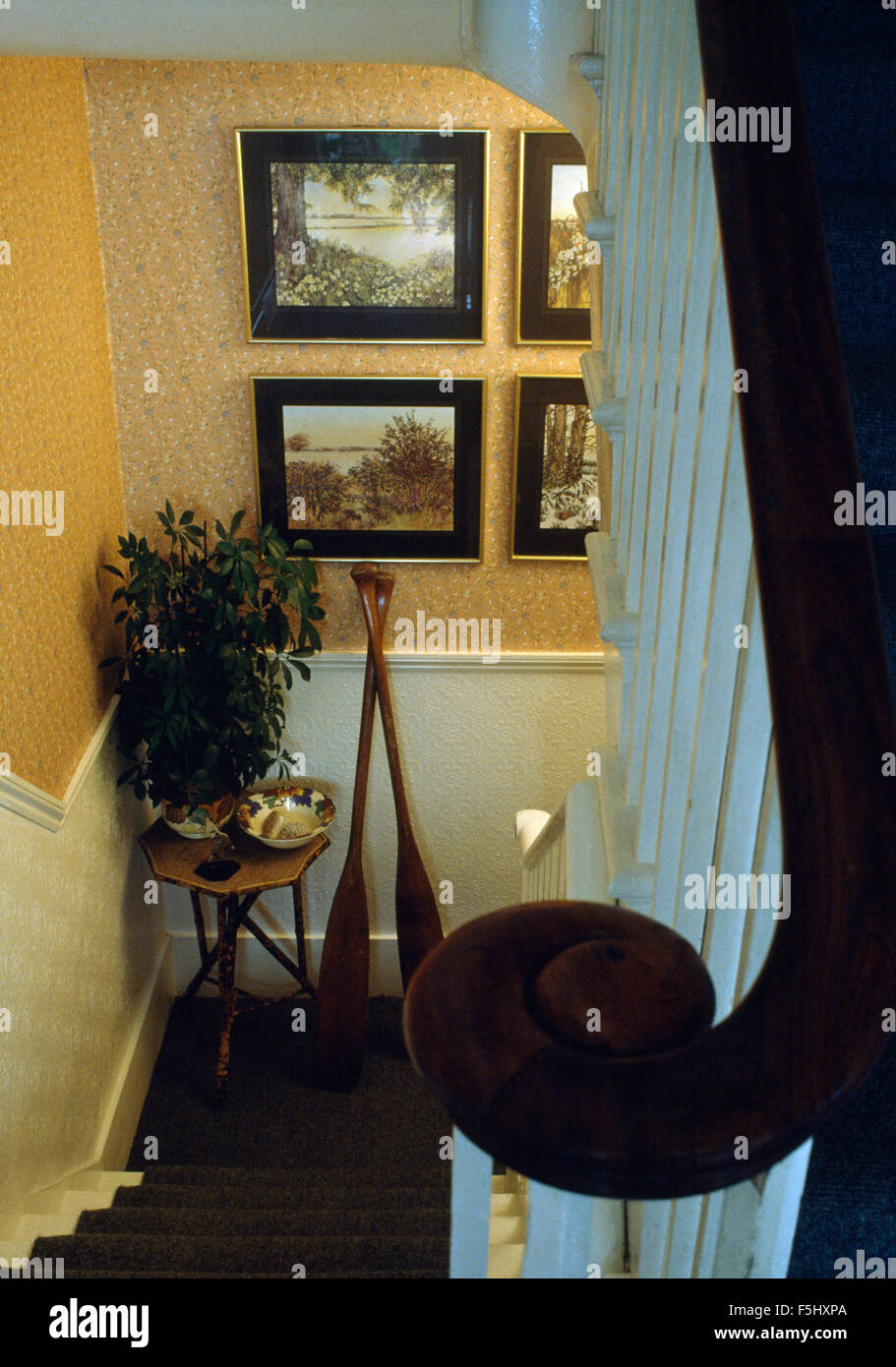 Pair of wooden oars beside bamboo table on sixties landing Stock Photo