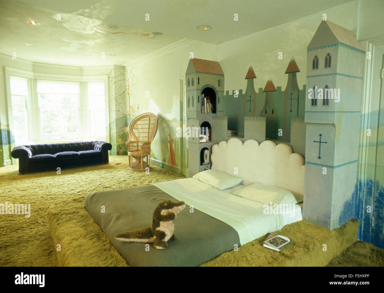 Castle themed bed in child's seventies bedroom with shag pile carpet Stock Photo