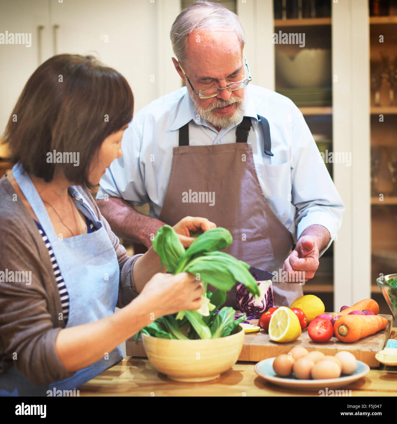 Couple Helping Cooking Preparation Concept Stock Photo - Alamy