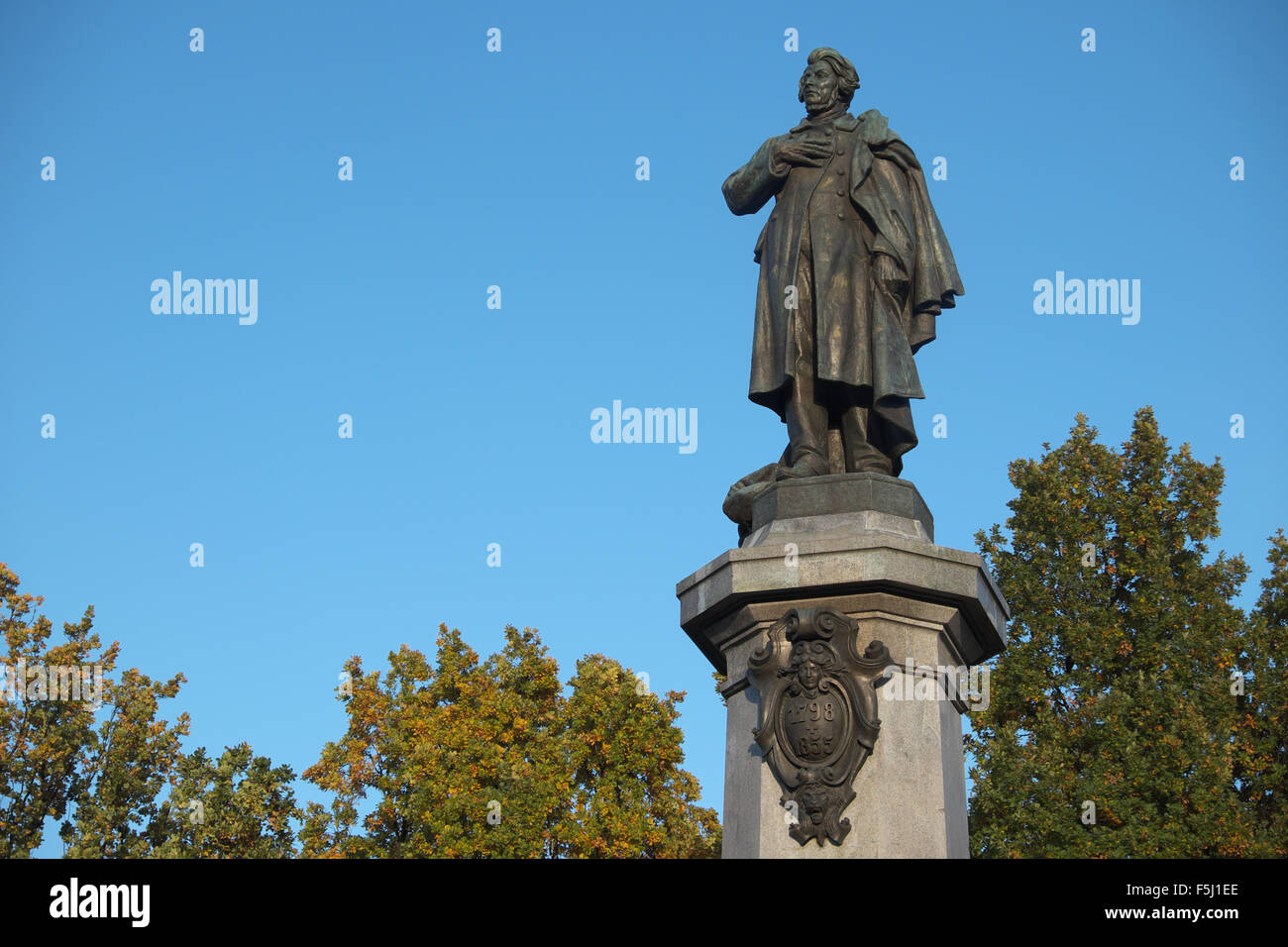 Warsaw Poland statue of Polish poet Adam Mickiewicz on street Ul Ulica Krakowskie Przedmiescie Stock Photo