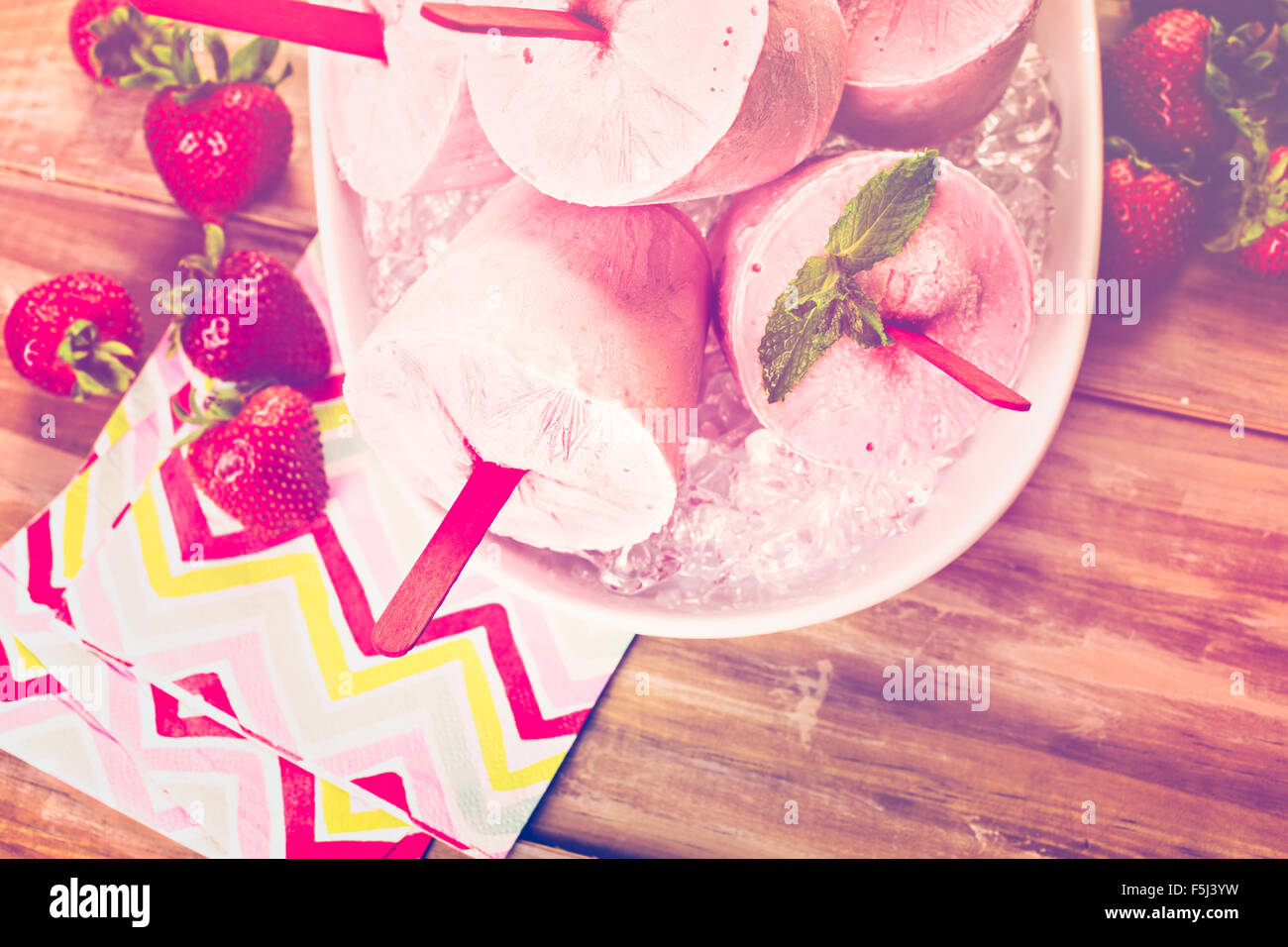 Homemade strawberry popsicles made in plastic cups Stock Photo Alamy