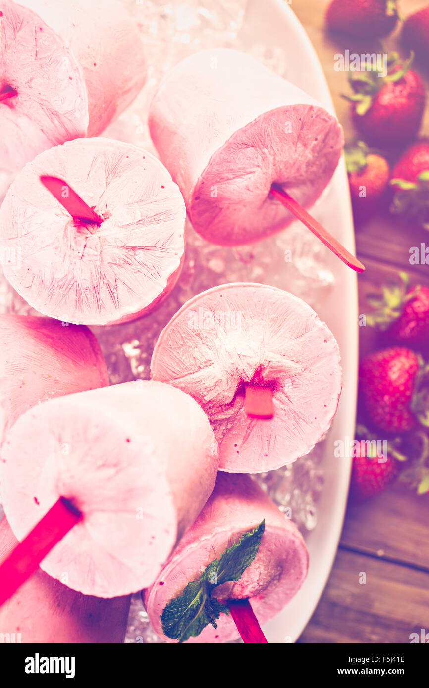 Homemade strawberry popsicles made in plastic cups Stock Photo Alamy