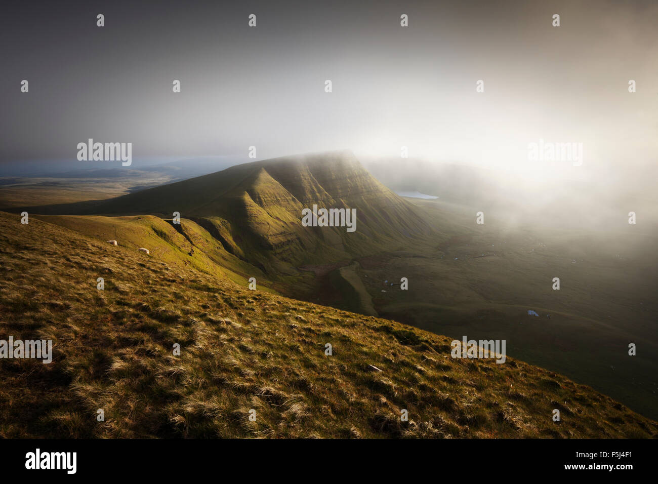 Mist rolling in over Picws Du. The Black Mountain. Brecon Beacons National Park. Carmarthenshire. Wales. UK. Stock Photo