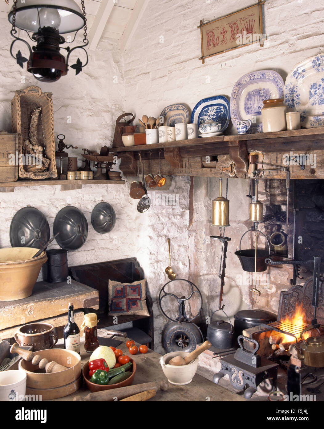 Interior of a Victorian style kitchen with cast iron pots hanging above  stove Stock Photo - Alamy, image size:1052x1390