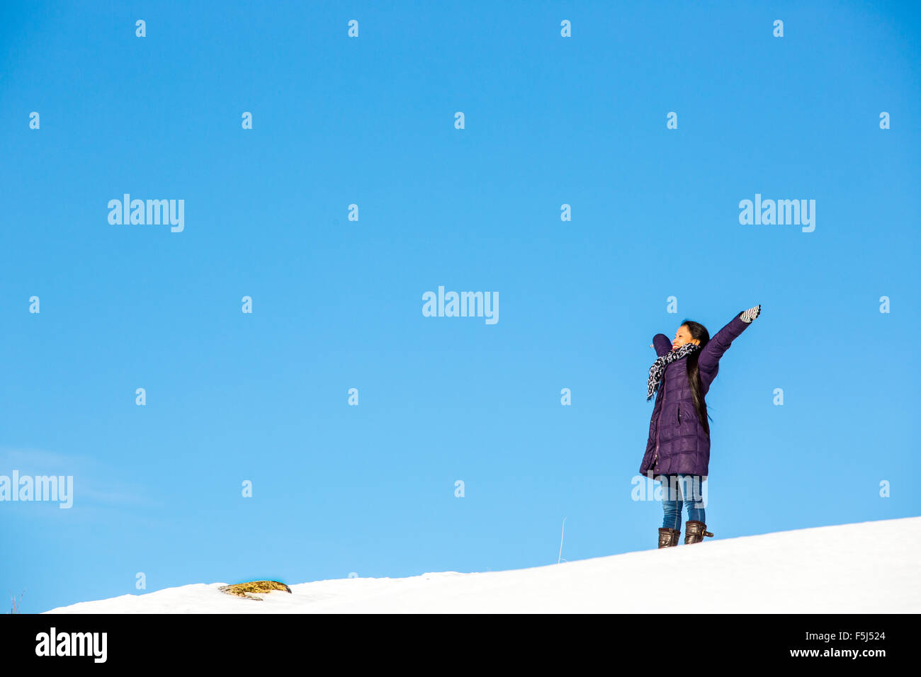 Female outdoor exercise in cold weather in winter Stock Photo