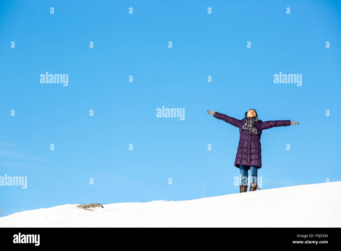 Female outdoor exercise in cold weather in winter Stock Photo