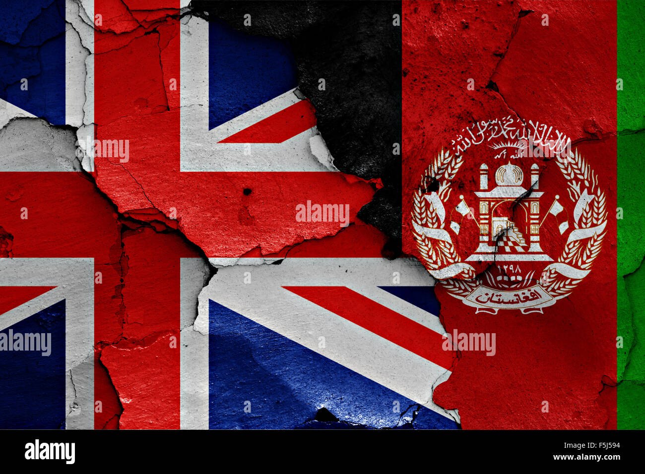 flag of UK and Afghanistan painted on cracked wall Stock Photo