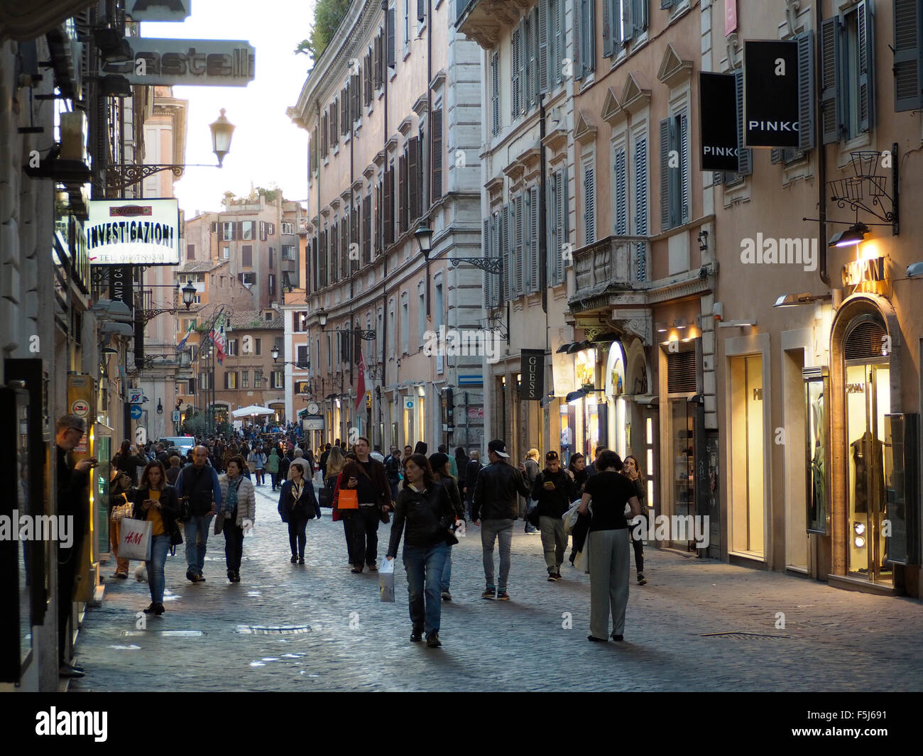 Via Frattina in the shopping district of Rome, Italy, near the Spanish steps, with many people Stock Photo