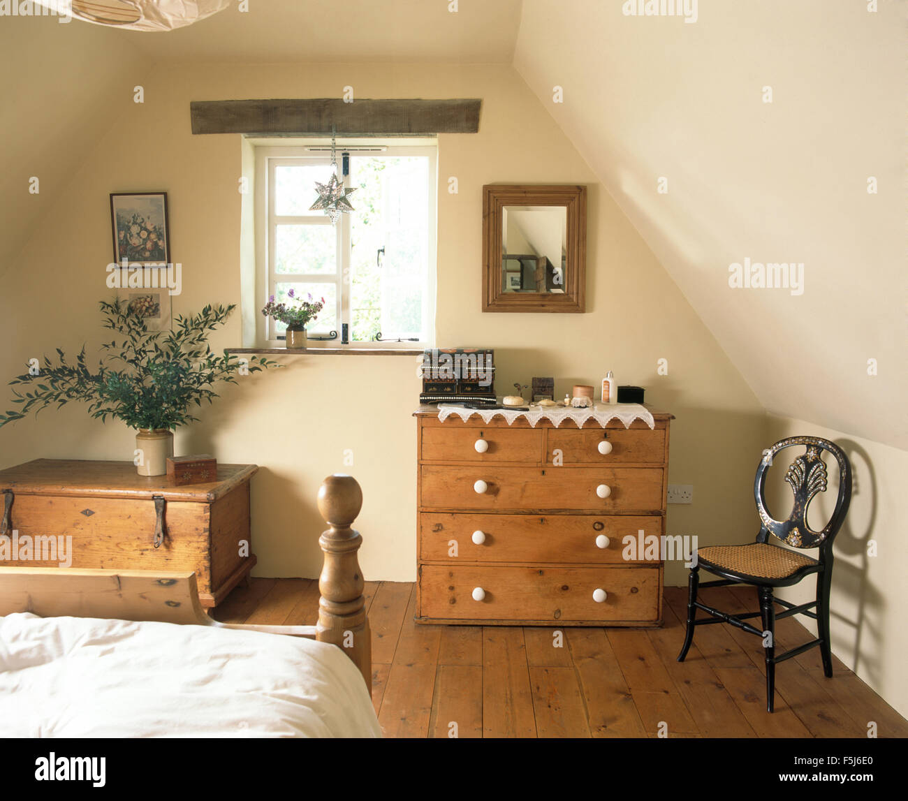 Small Antique Chair And A Pine Chest Of Drawers In A Cottage