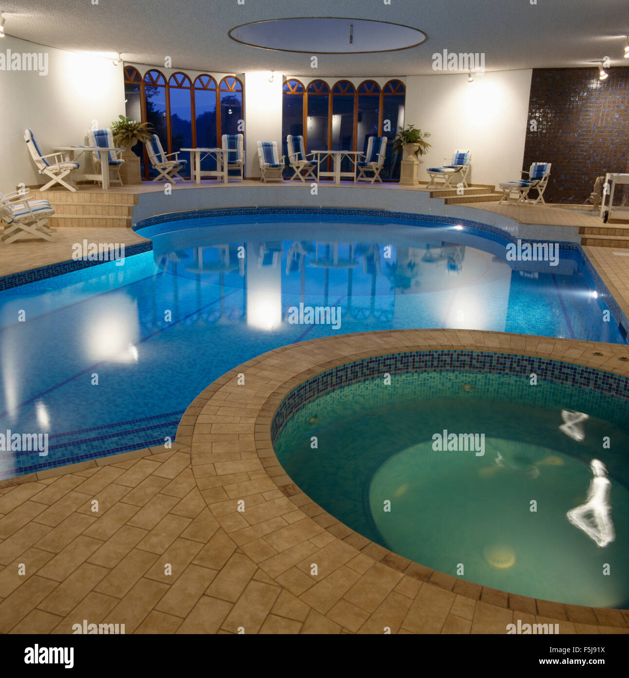 Eighties private indoor swimming pool with a Jacuzzi tub Stock Photo