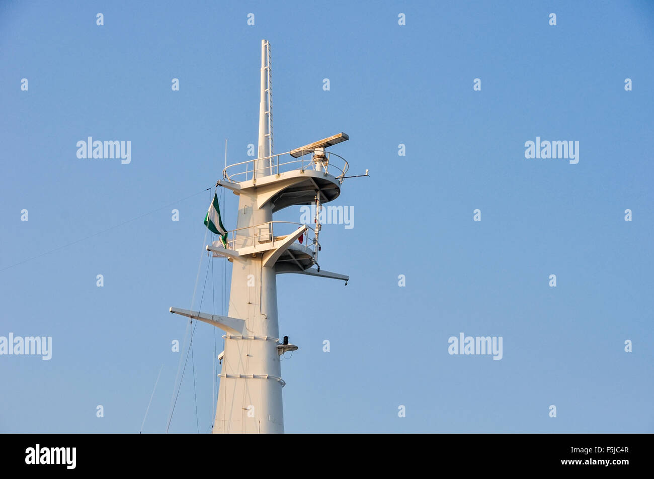 Mast with navigation, communication and safety equipment on ship Stock Photo