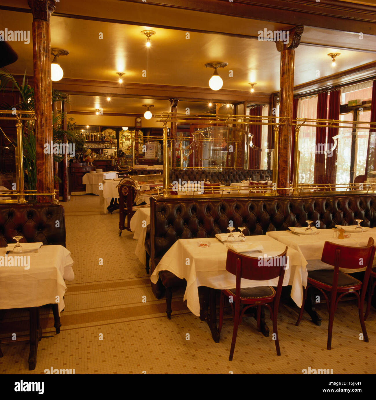 Leather Banquette Seating And Tables With Crisp White Cloths