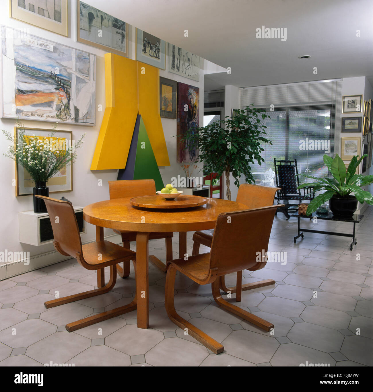 Veneered forties style table and chairs in nineties dining room with ...