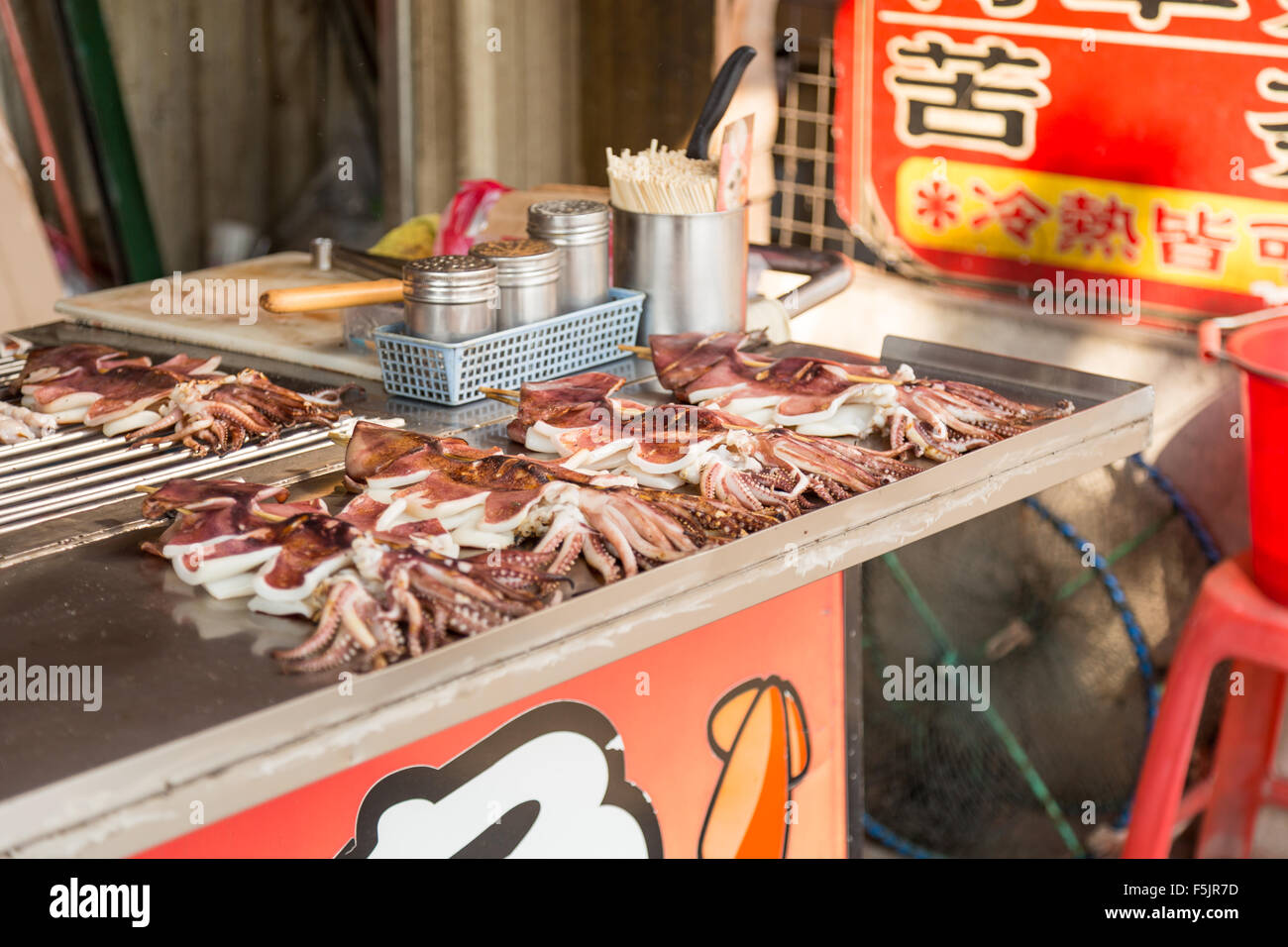 NEW TAIPEI CITY, TAIWAN - SEPTEMBER 11, 2015: Squid on a stick at
