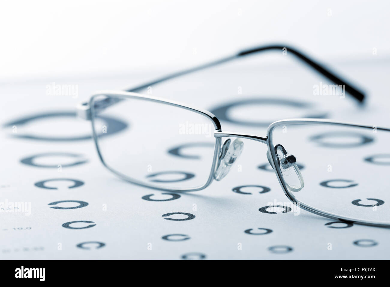 Eye examination chart with glasses Stock Photo
