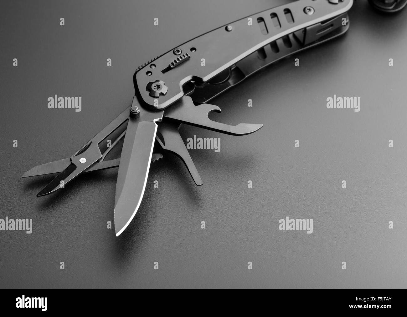 Closeup of black opened multitool knife Stock Photo Alamy