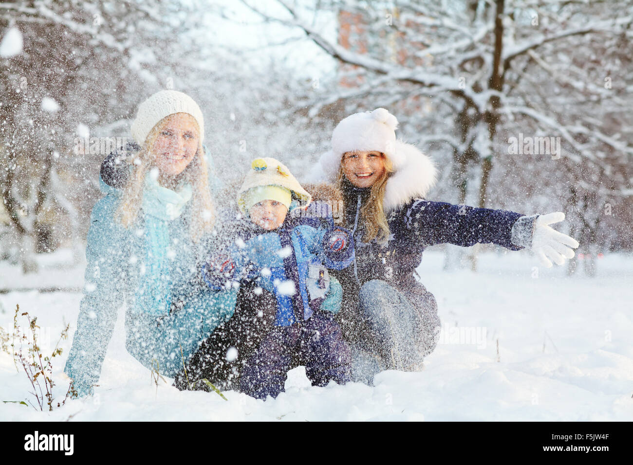 happy mother and children in winter park Stock Photo