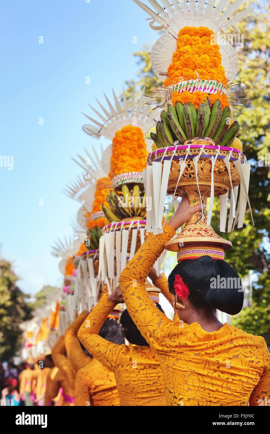 Procession of beautiful Balinese women in traditional costumes sarong