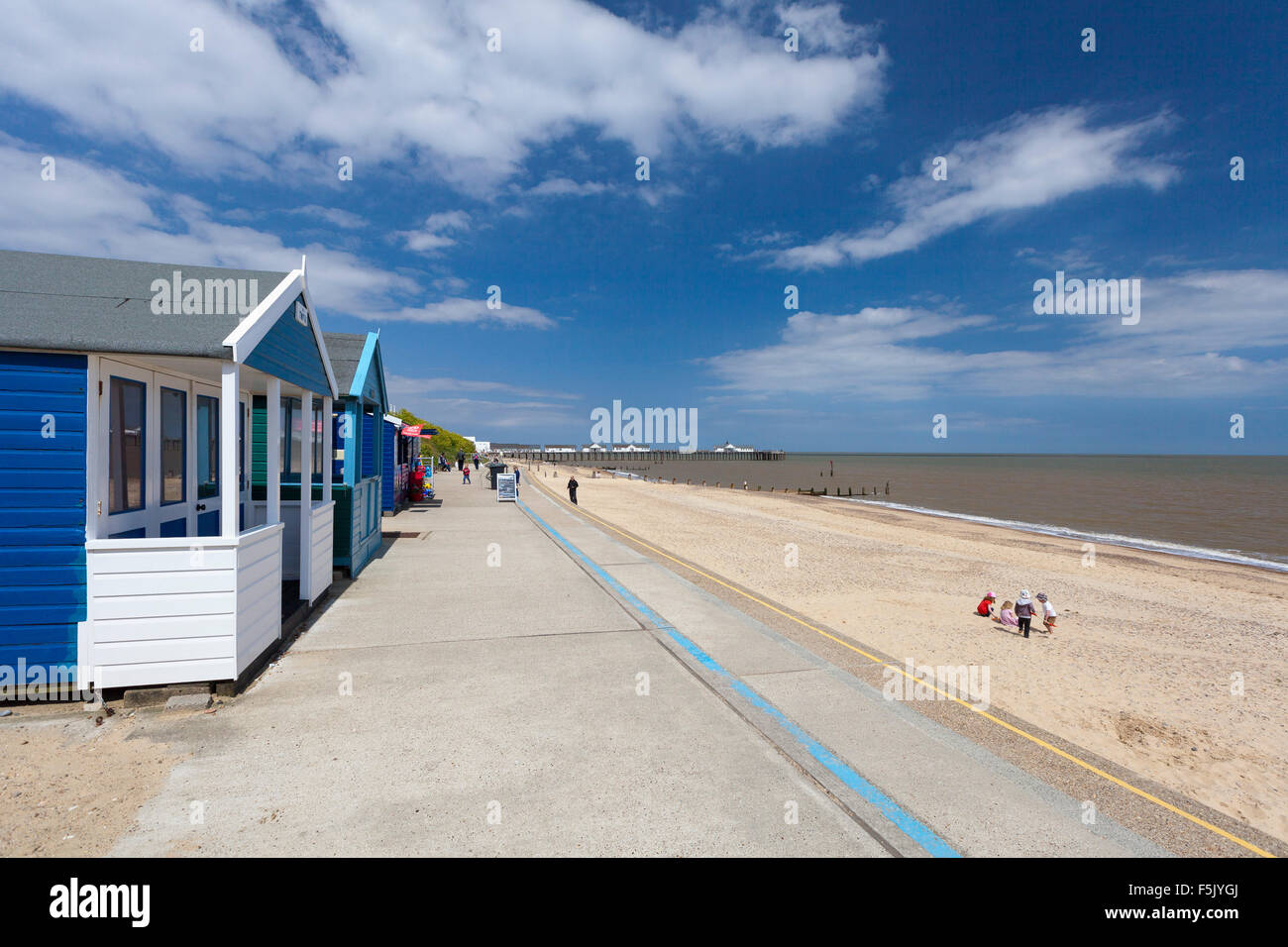 Children on beach with beach huts at Southwold Stock Photo - Alamy