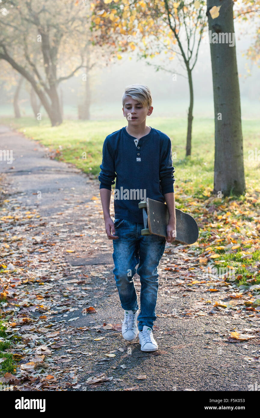 Skateboarding on a sunny autumnal day in a London park Stock Photo