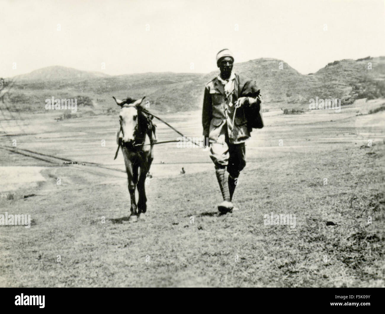 African man with a horse , East Africa Stock Photo