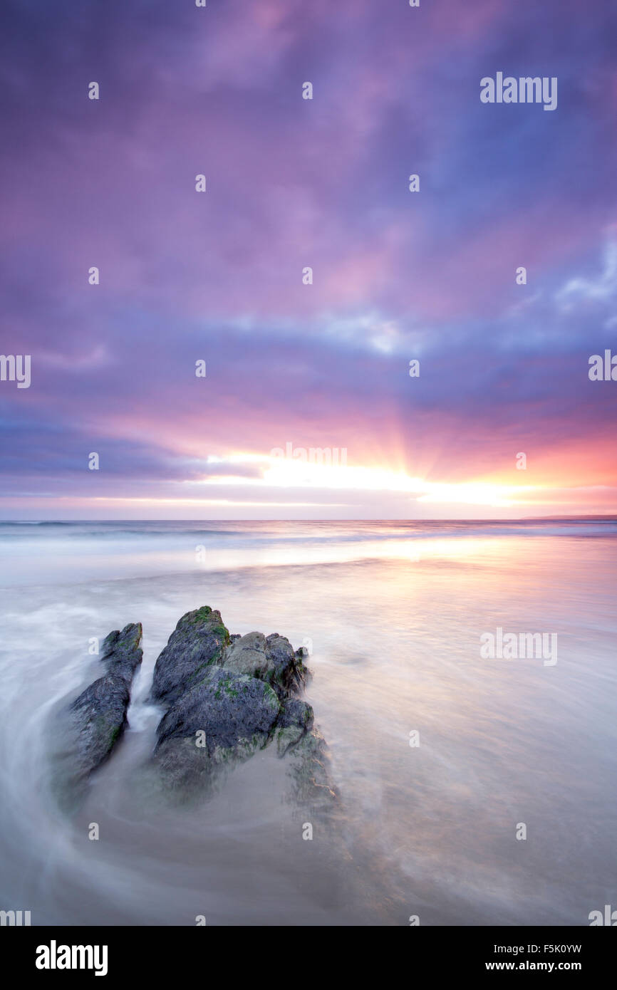 Sunset and receding tide at  Freathy Beach Whitsand Bay Cornwall UK Stock Photo
