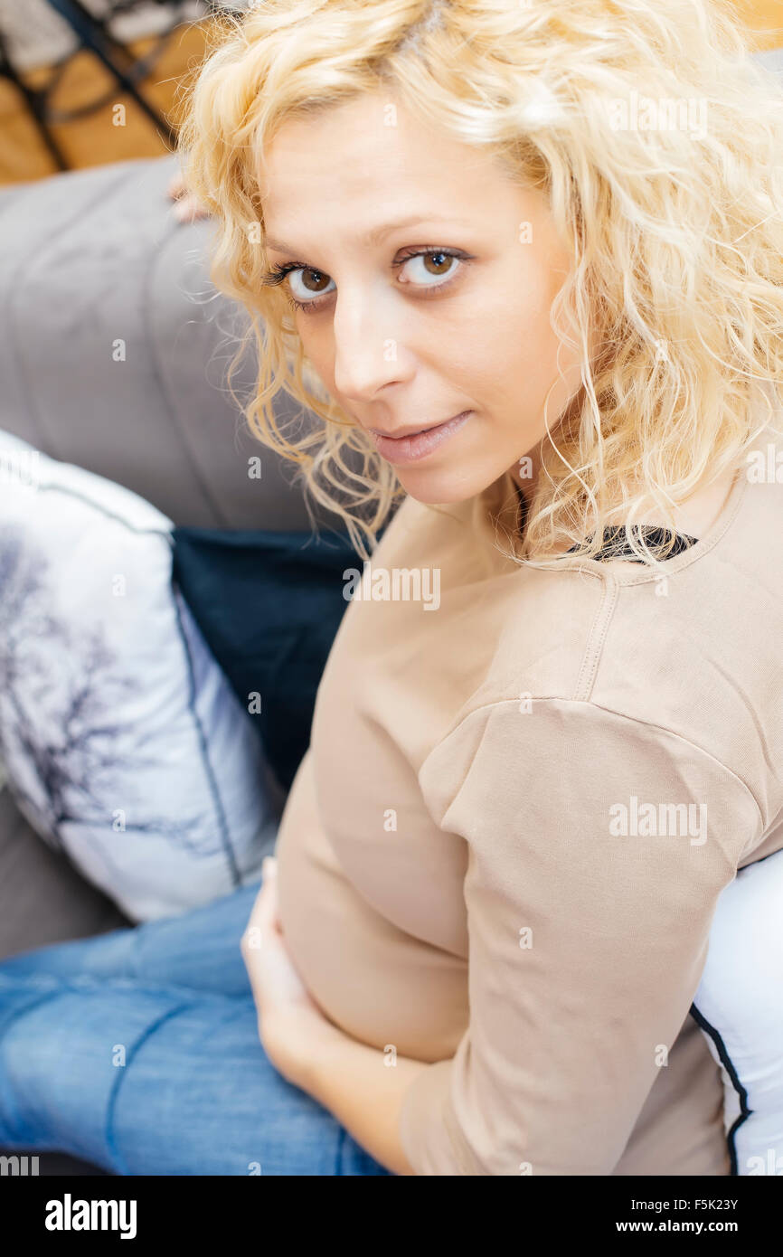 Young pregnant woman in the room Stock Photo