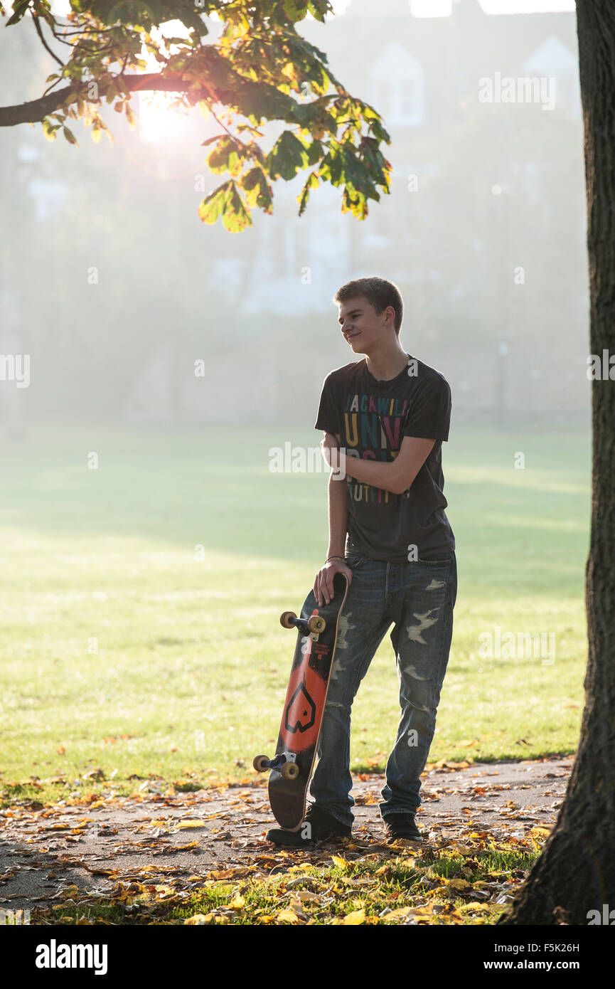 Skateboarding on a sunny autumnal day in a London park Stock Photo