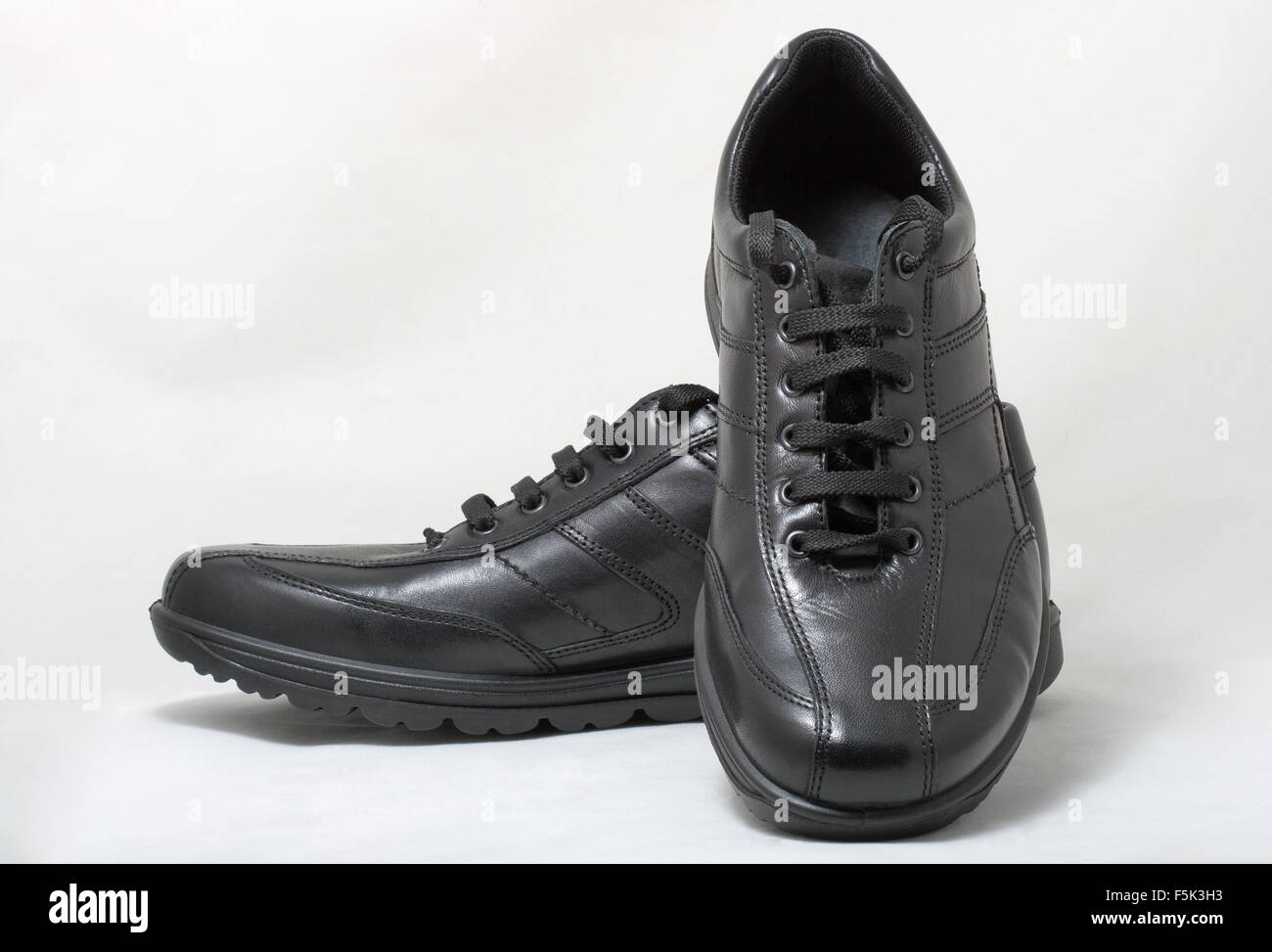 Pair of black man leather shoes with shoelace on white background Stock ...