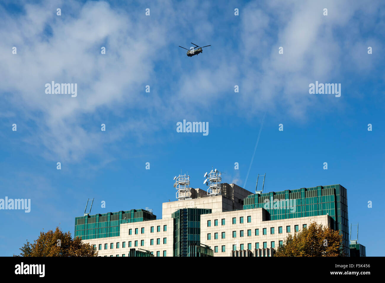 A Chinook Helicopter flies over Mi6 Headquarters in Vauxhall, London Stock Photo
