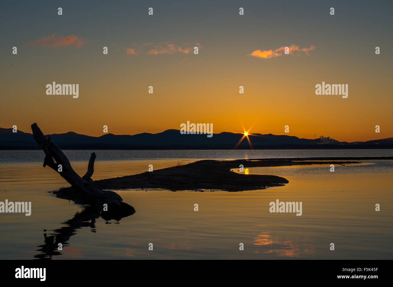 The sun coming up across Lake Champlain Stock Photo