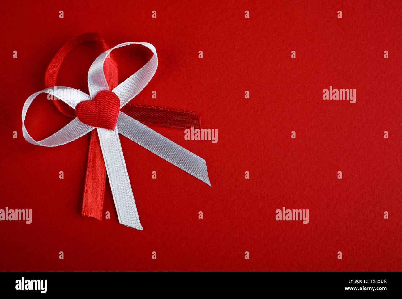 White and red bow with heart Stock Photo