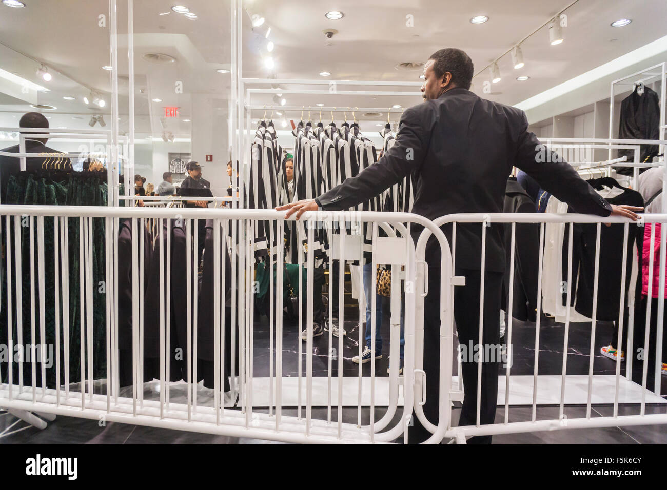 New York, USA. 05th Nov, 2015. A security guard in the designated Balmain x H&M section of an H&M store in New York on Thursday, November 5, 2015. The collection, designed by the young head of Balmain, Olivier Rousteing, was highly anticipated by fashionistas and drew crowds around the world. In New York H&M instituted a wristband system to time when shoppers could arrive to control crowds. Credit:  Richard Levine/Alamy Live News Stock Photo
