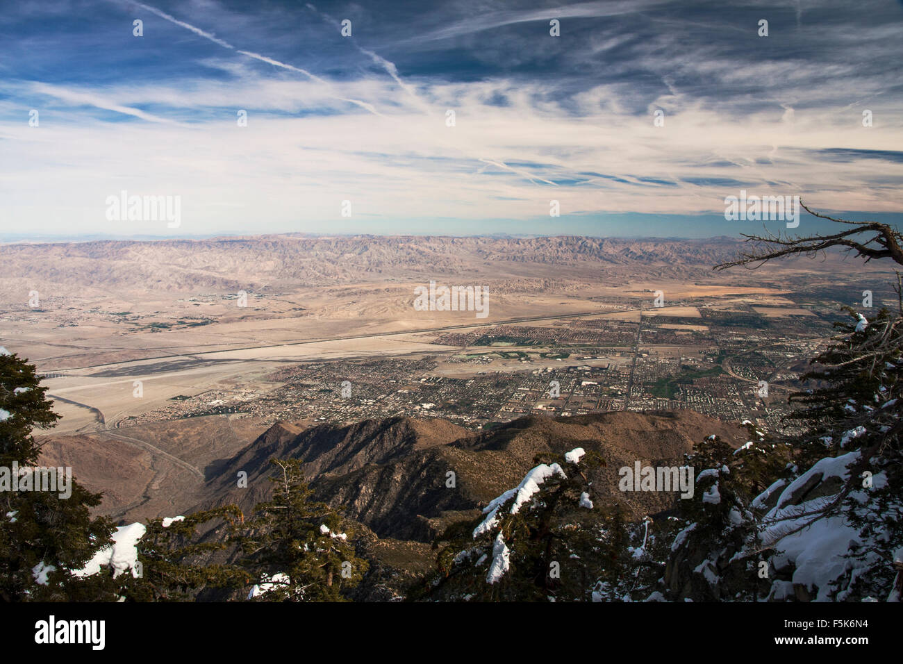Mount Jacinto with snow covered peaks overlooking the airport and desert of Palm Springs below Stock Photo